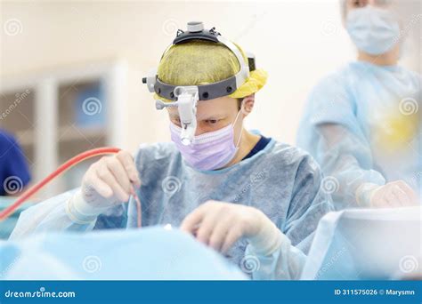 Maxillofacial Surgeon Using Microscope